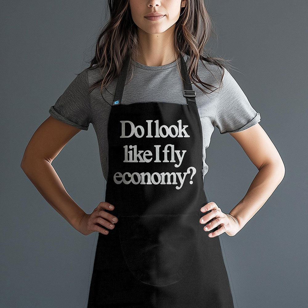 Est-ce que j'ai l'air de voyager en classe économique ? - Tablier de cuisine